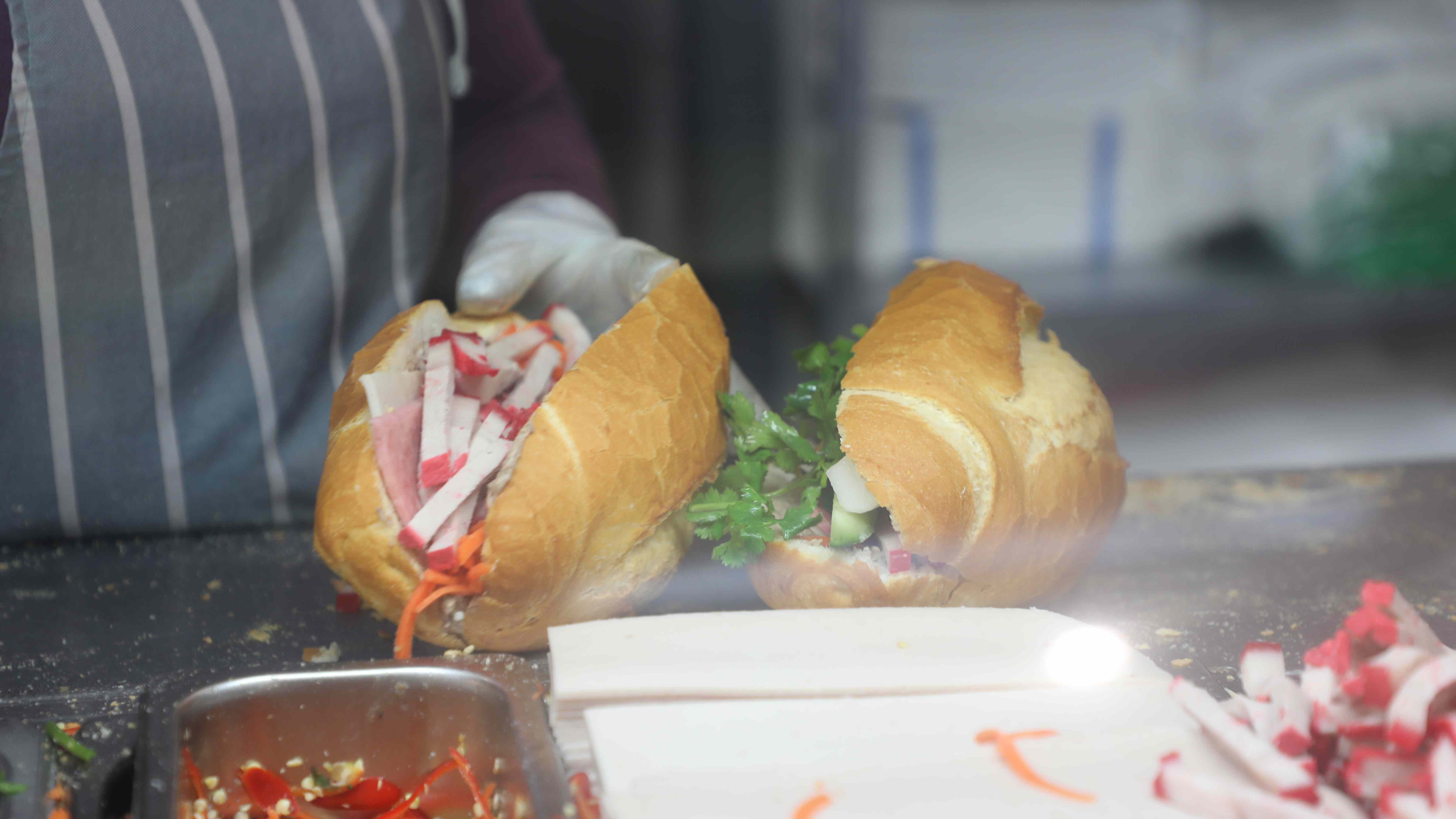 Bánh mì being assembled at KK Bakery