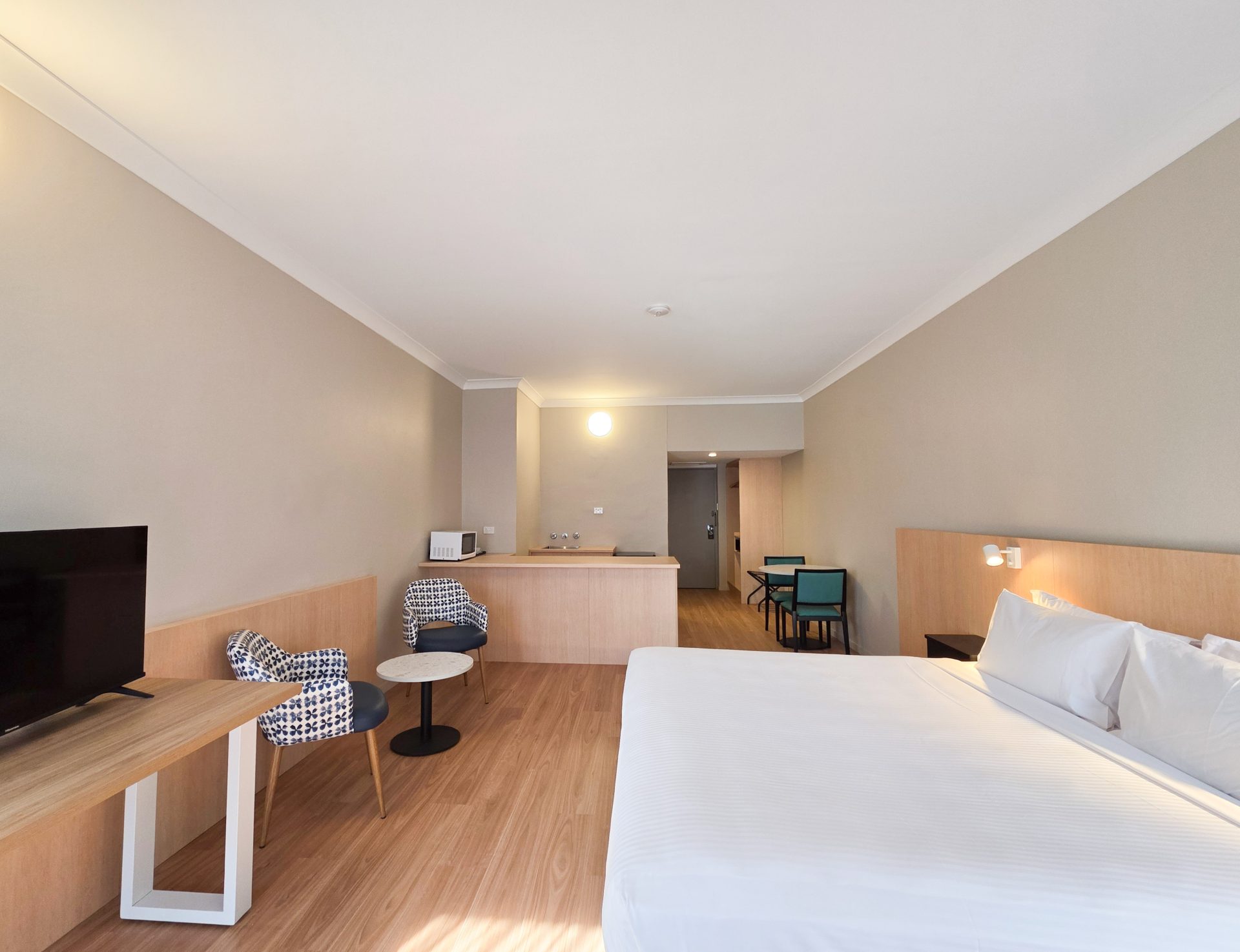 A refurbished suite with a kitchenette at El Toro Motel in Warwick Farm